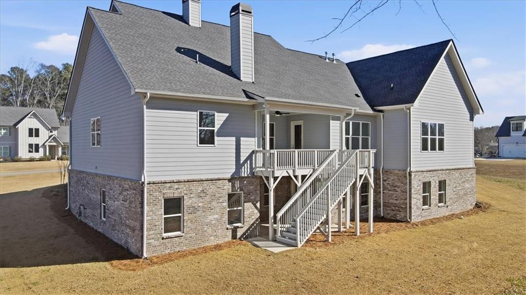216 Ewing Way Dacula, GA 30019 - Photo 79 of 80 a view of a house with wooden stairs