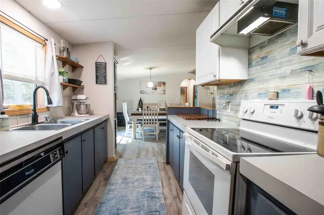 a kitchen with a sink and cabinets