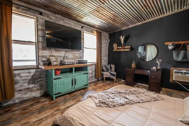 a living room with furniture flat screen tv and a fireplace