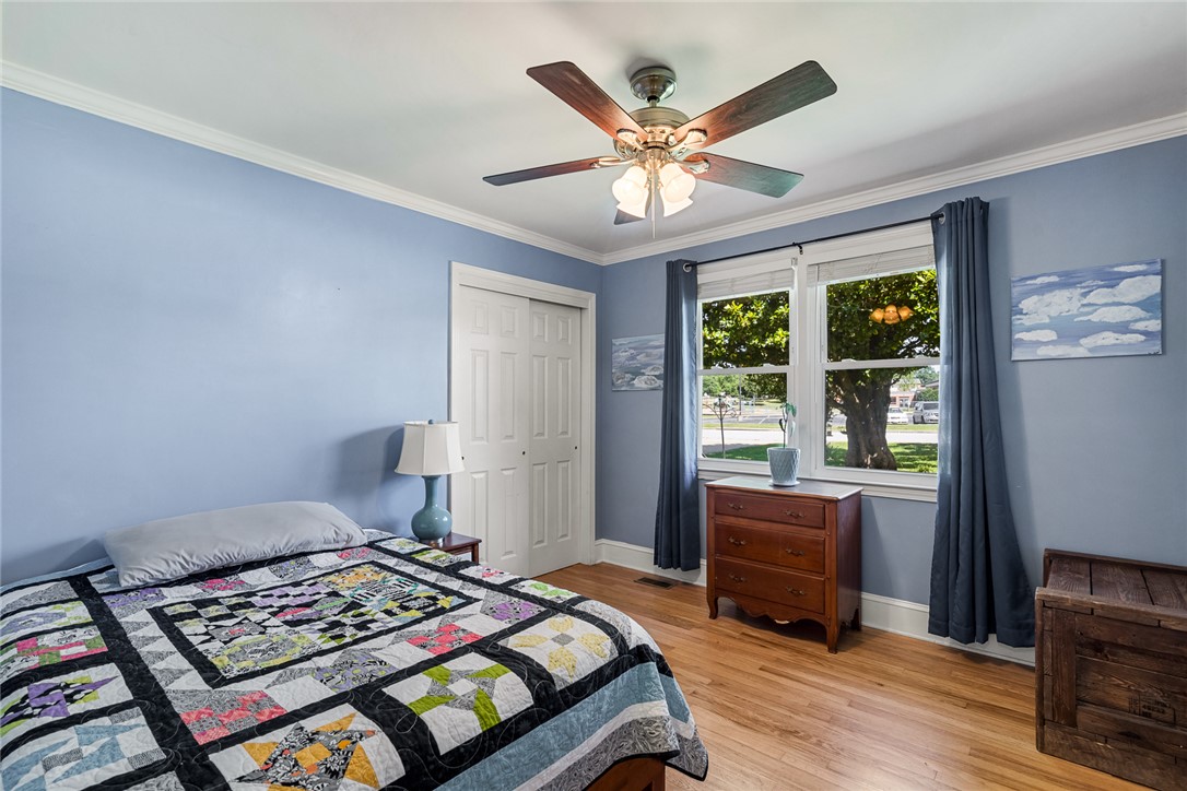 512 East Fredericks Street Anderson, SC 29621 - Photo 20 of 31 Hardwood floors and bright windows create an inviting, restful bedroom.