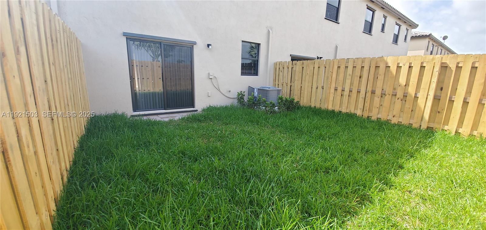 11214 Southwest 249th Street Homestead, FL 33032 - Photo 15 of 16 a view of a house with backyard