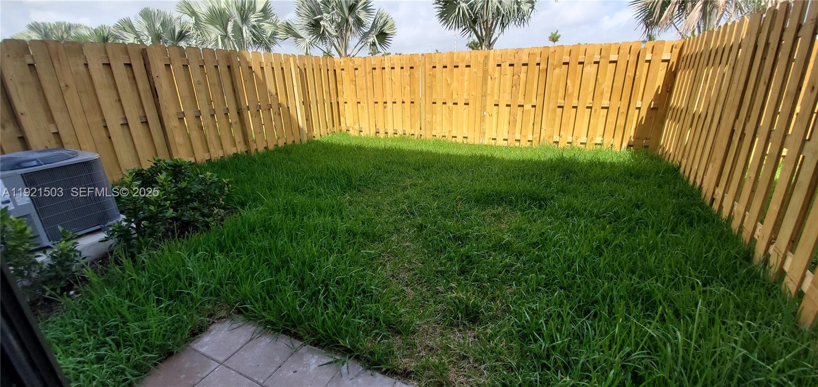 11214 Southwest 249th Street Homestead, FL 33032 - Photo 16 of 16 a view of a backyard with wooden fence