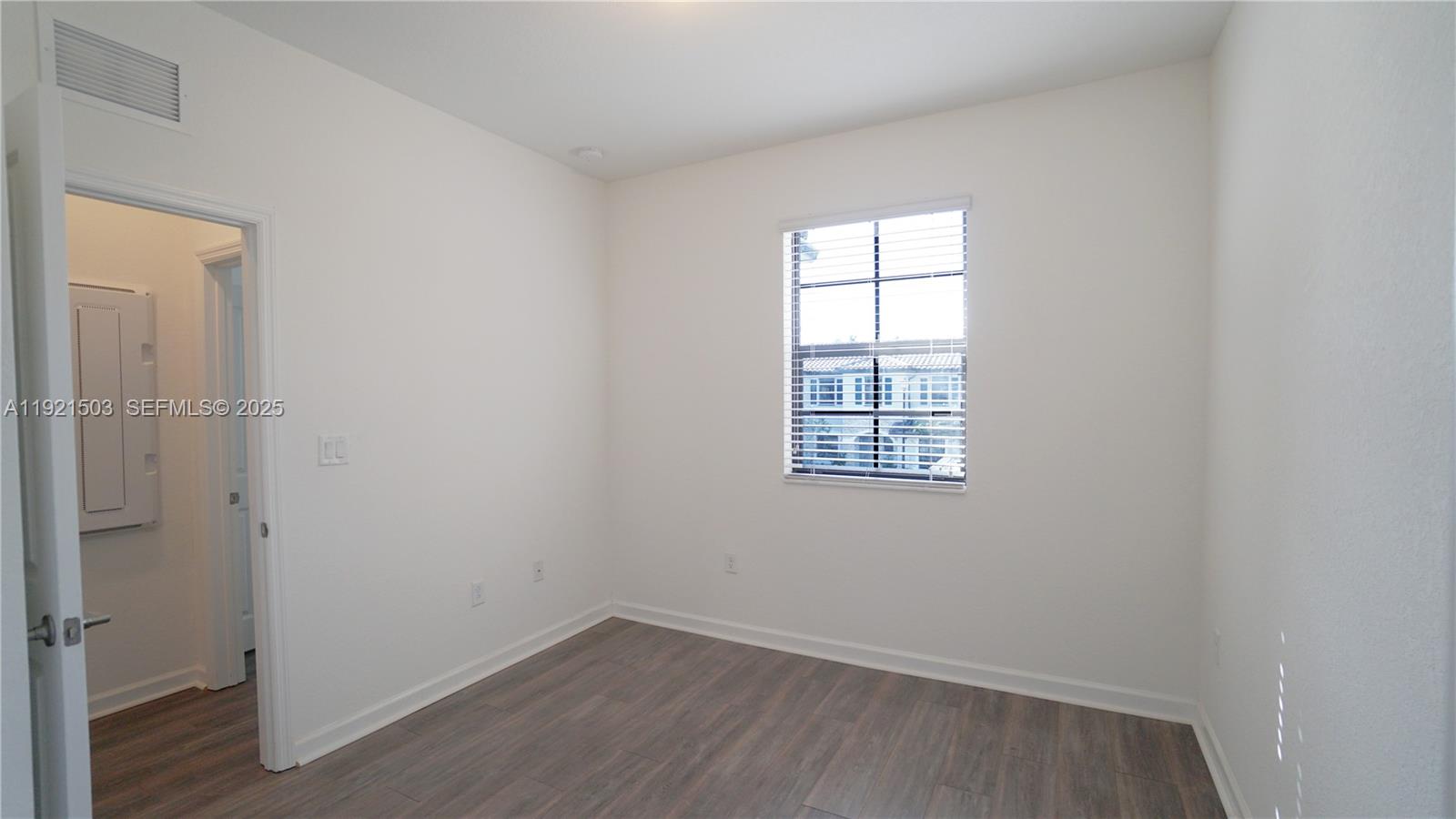 11214 Southwest 249th Street Homestead, FL 33032 - Photo 10 of 16 an empty room with a window