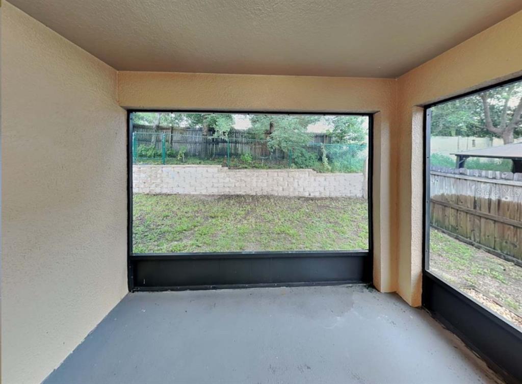 1805 Concord Drive Apopka, FL 32703 - Photo 12 of 12 an empty room with large windows
