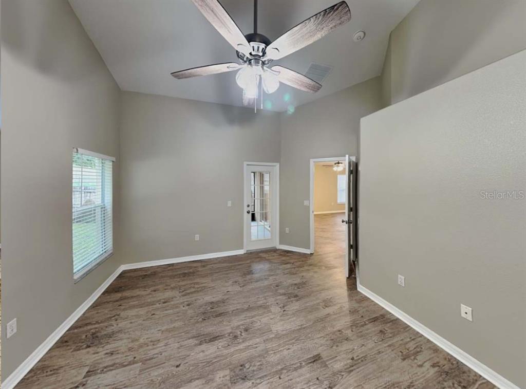1805 Concord Drive Apopka, FL 32703 - Photo 8 of 12 an empty room with fan and windows