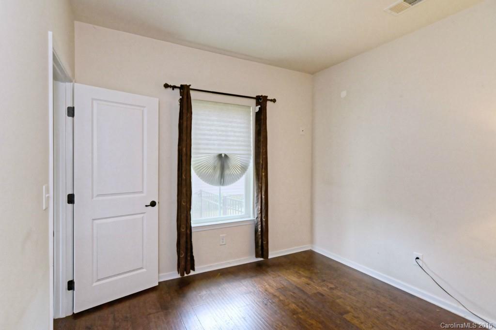 1605 Ridgehaven Road Waxhaw, NC 28173 - Photo 13 of 24 a view of an empty room with wooden floor and closet