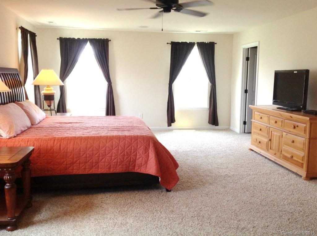 1605 Ridgehaven Road Waxhaw, NC 28173 - Photo 14 of 24 a bed room with a bed and a television