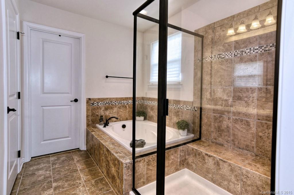 1605 Ridgehaven Road Waxhaw, NC 28173 - Photo 17 of 24 a bathroom with a tub and shower
