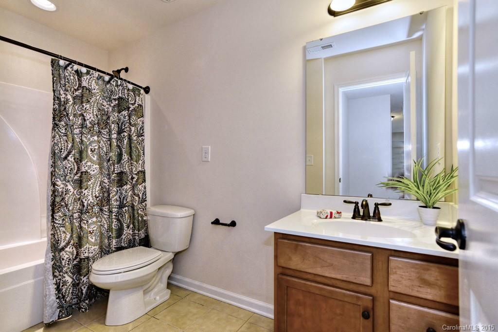 1605 Ridgehaven Road Waxhaw, NC 28173 - Photo 22 of 24 a bathroom with a sink a toilet and shower