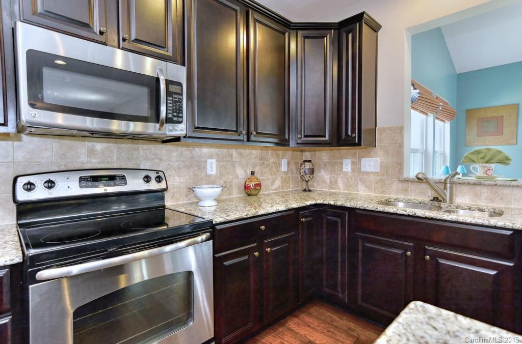 1605 Ridgehaven Road Waxhaw, NC 28173 - Photo 8 of 24 a kitchen with a sink stove and microwave