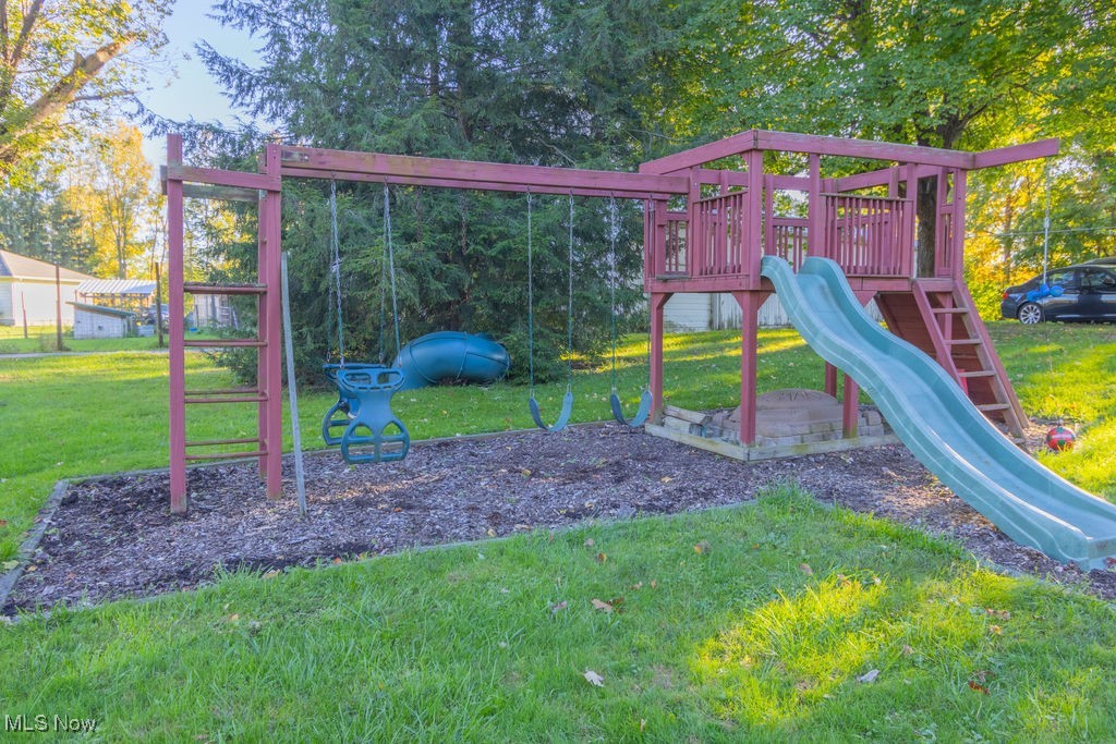 2121 South Cleveland Massillon Road Akron, OH 44321 - Photo 22 of 26 View of playground featuring a lawn