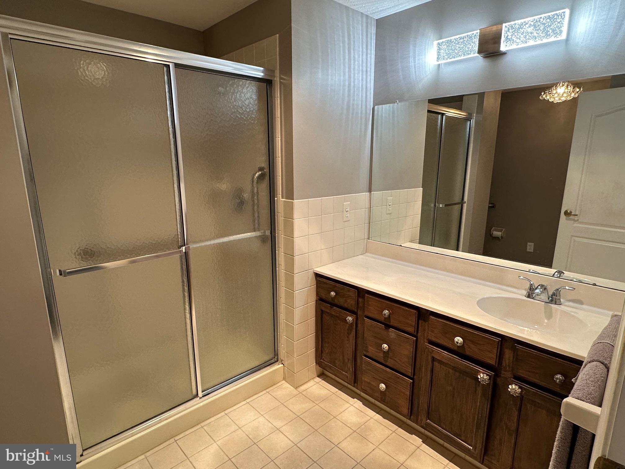 48 Maple Leaf Circle Sewell, NJ 08080 - Photo 16 of 23 a bathroom with a double vanity sink and mirror