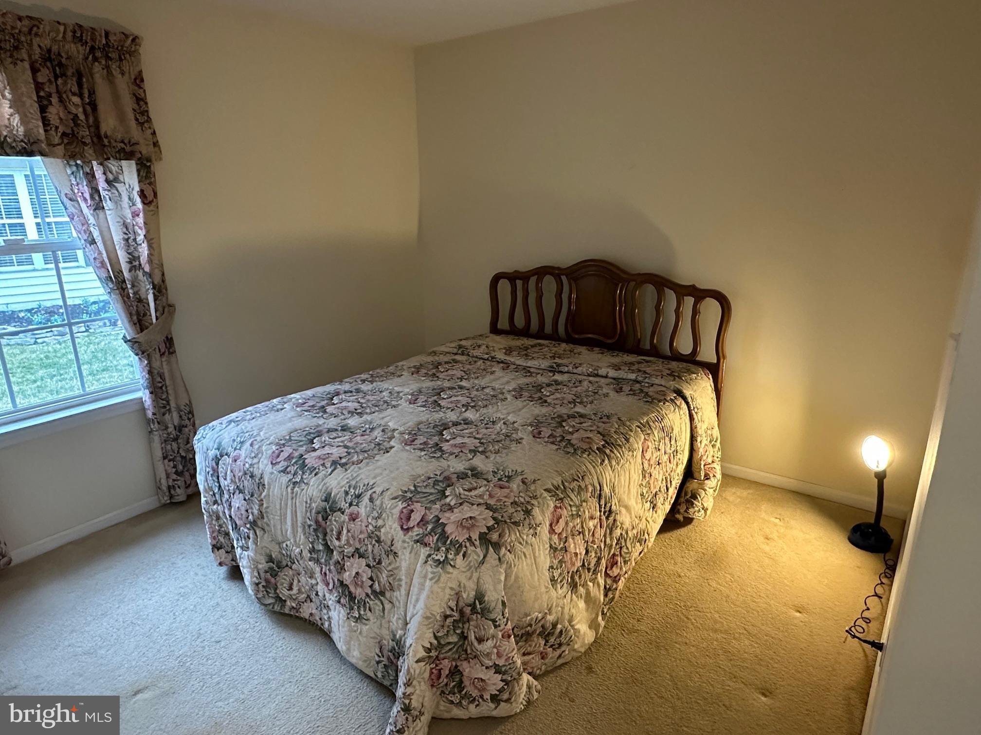 48 Maple Leaf Circle Sewell, NJ 08080 - Photo 17 of 23 a bed sitting in a bedroom next to a window