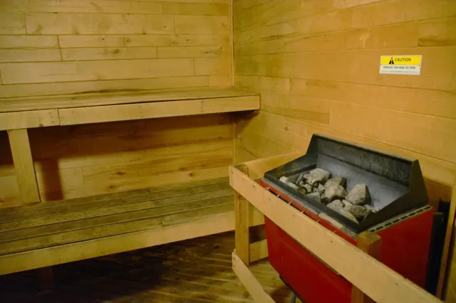 a view of yard with swimming pool and seating space