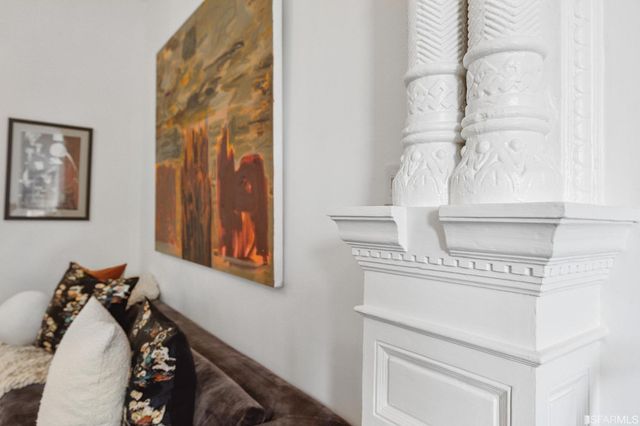 a living room with a table and a potted plant