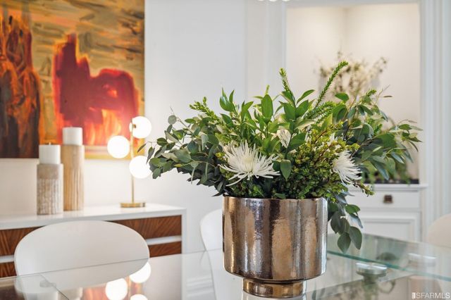 a vase of flowers sitting on a table