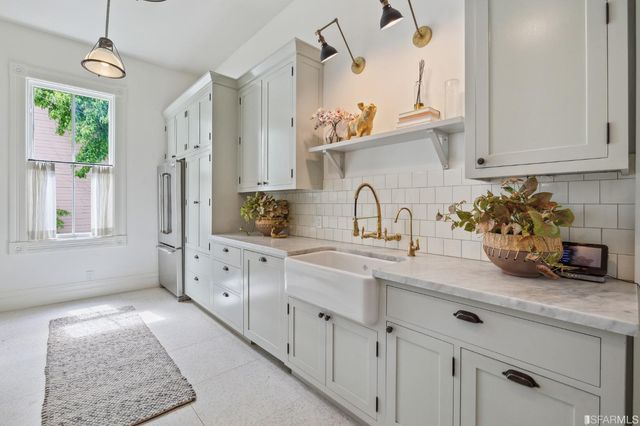 a bathroom with a sink and mirror