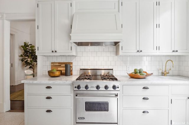 a bedroom with a bed and a table in it