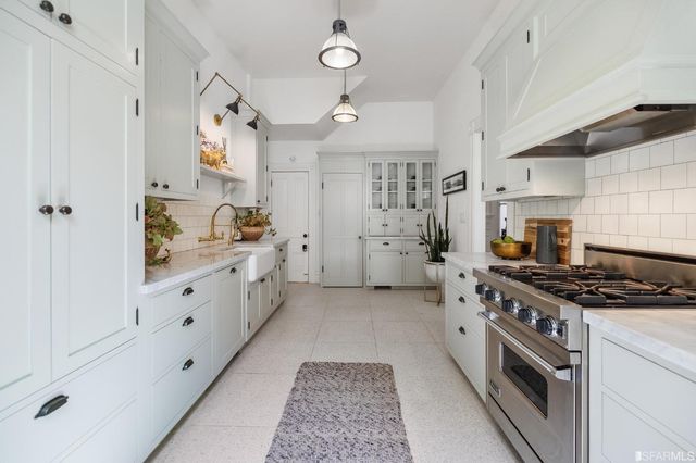 a bathroom with a toilet a sink and bathtub