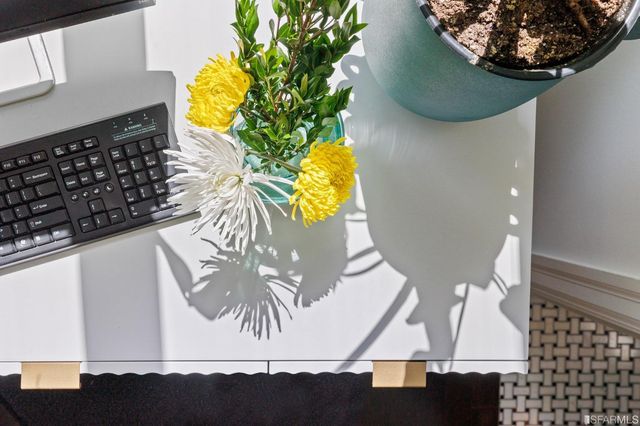 a view of staircase with wooden floor and white walls