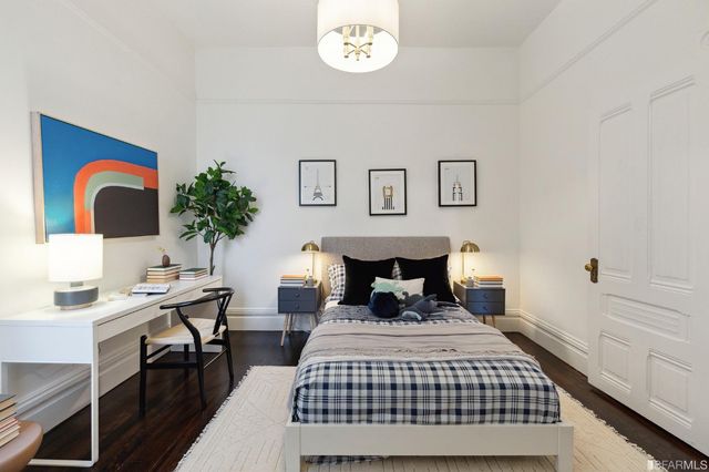 a backyard of a house with wooden floor and outdoor seating