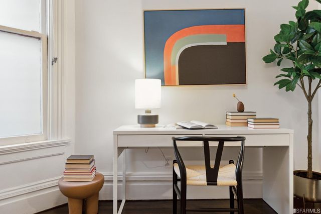 a view of a patio with couches table and chairs and potted plants