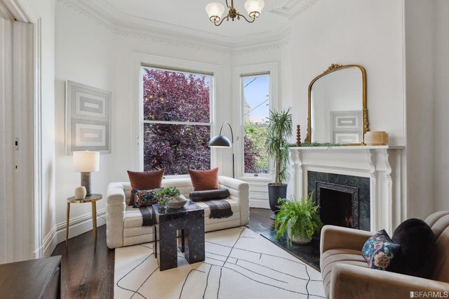 a dining room with furniture and wooden floor