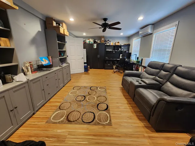 a sitting area with furniture and a backyard