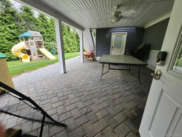 a view of a porch with furniture