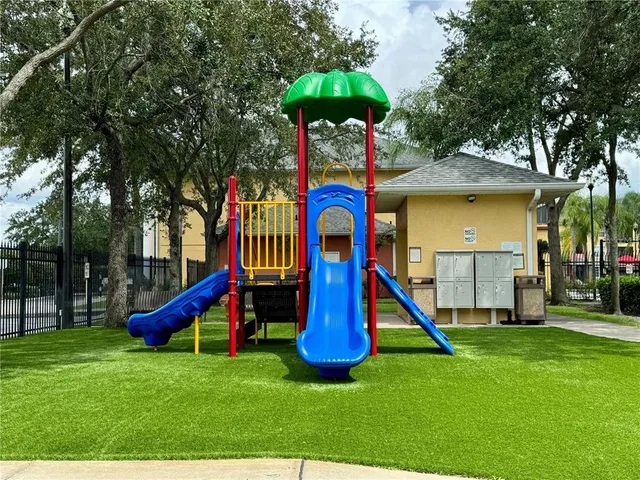 a childrens park with lots of swings and slides
