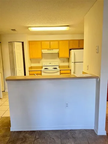 a view of a kitchen with a window