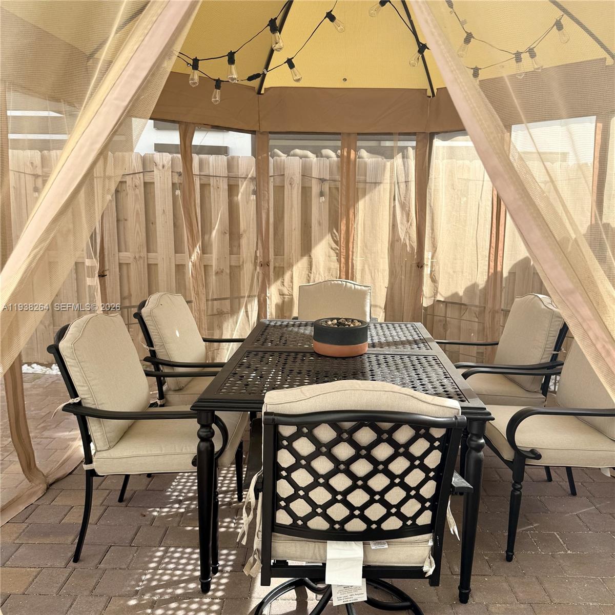 23049 Southwest 129th Place Miami, FL 33177 - Photo 29 of 29 a view of a chairs and table in patio