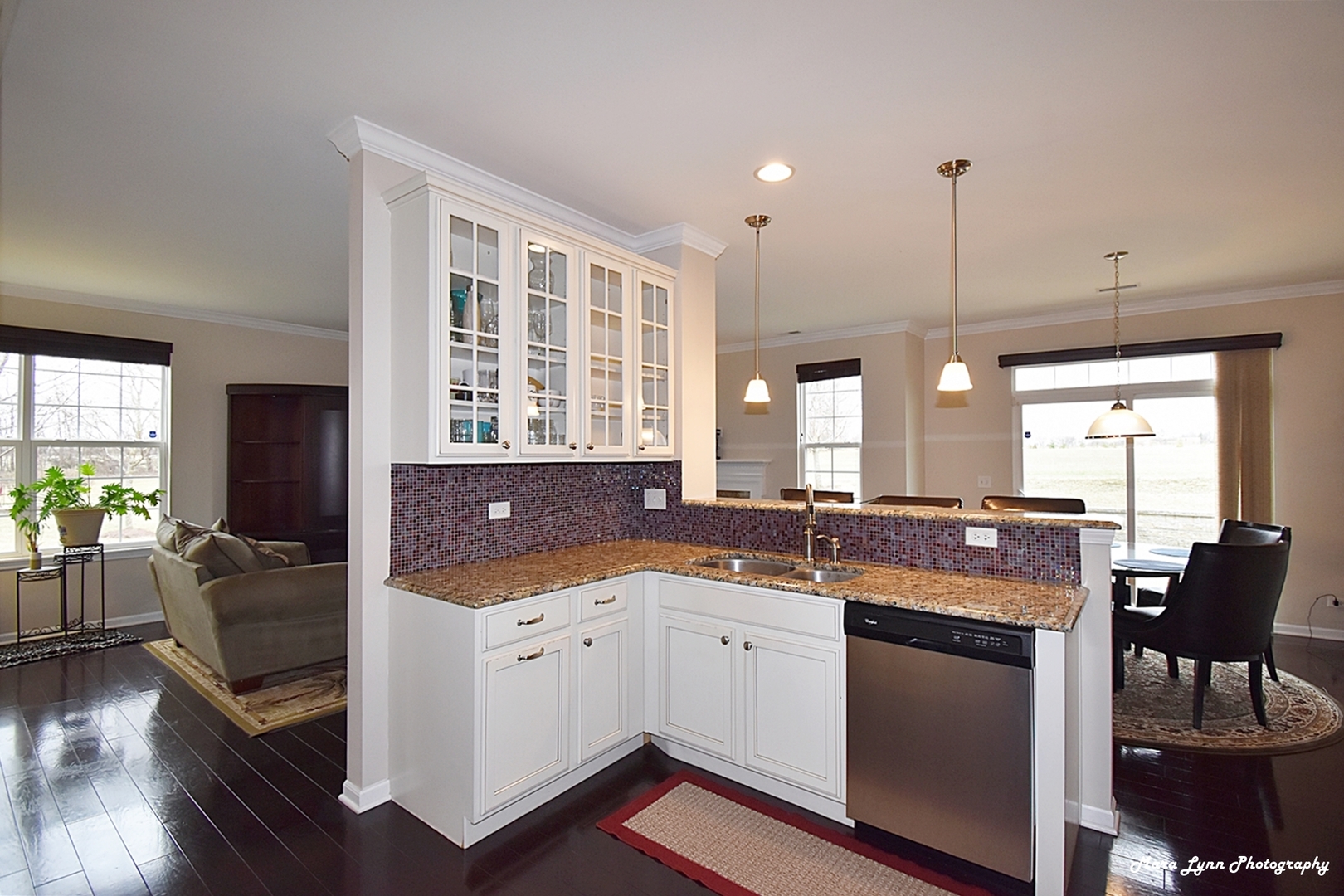 2872 Church Road Aurora, IL 60502 - Photo 22 of 38 a kitchen with a stove a sink a dining table and chairs