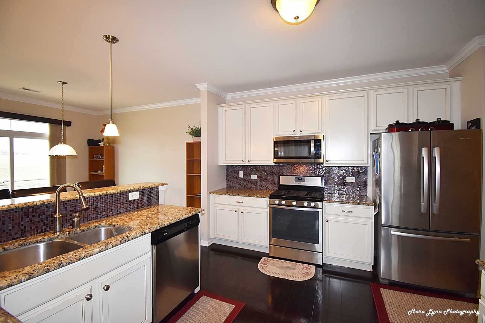 2872 Church Road Aurora, IL 60502 - Photo 23 of 38 a kitchen with a refrigerator a stove a sink and white cabinets