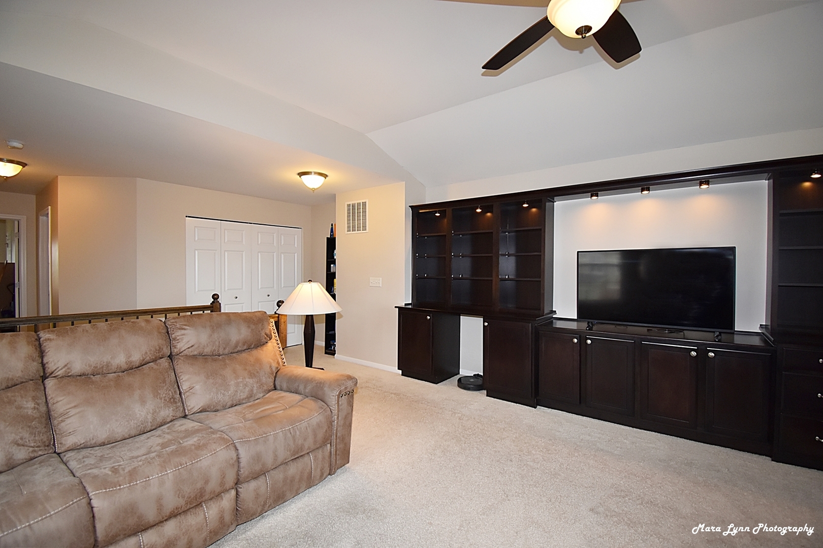 2872 Church Road Aurora, IL 60502 - Photo 24 of 38 a living room with furniture and a flat screen tv