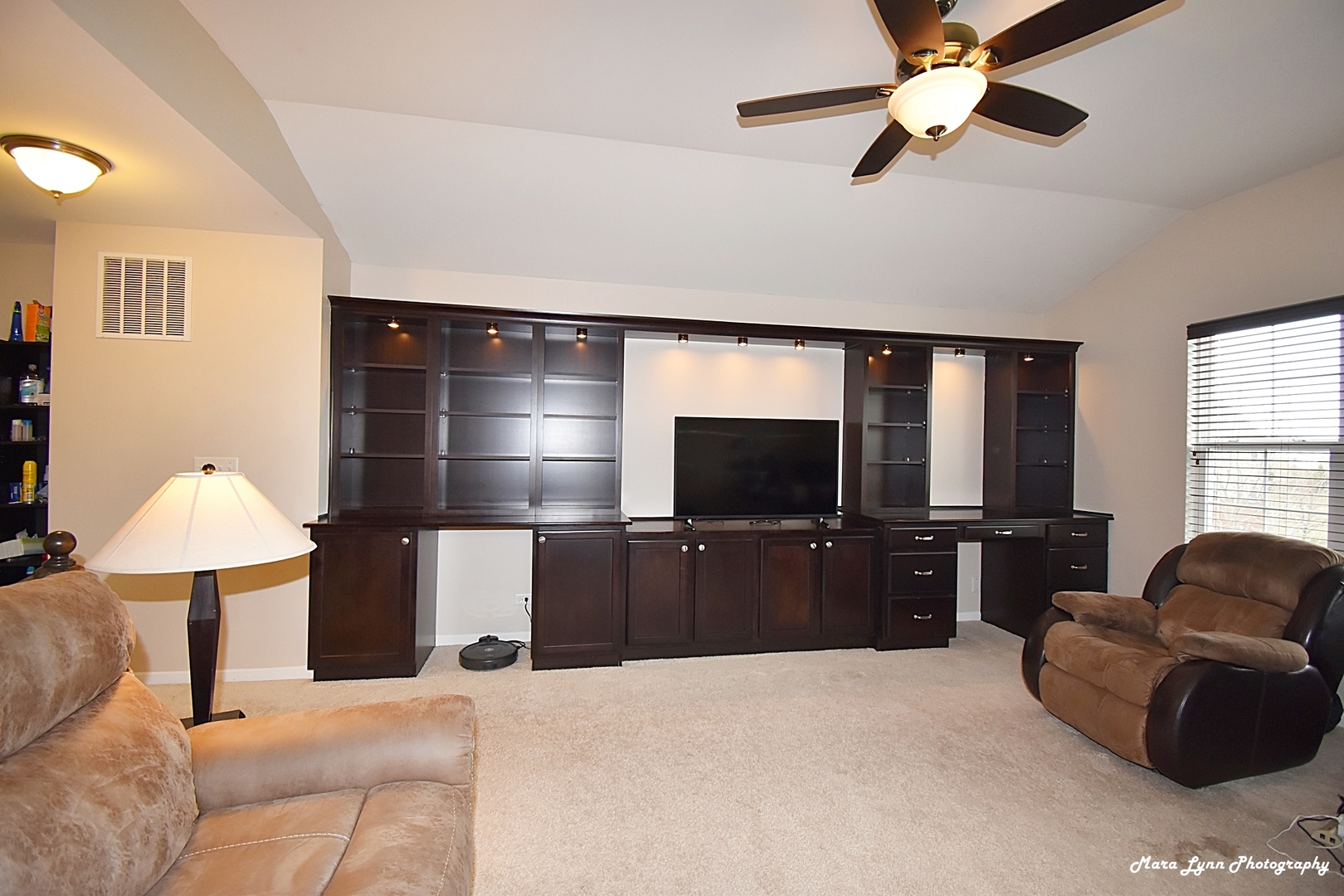 2872 Church Road Aurora, IL 60502 - Photo 25 of 38 a living room with furniture and a flat screen tv