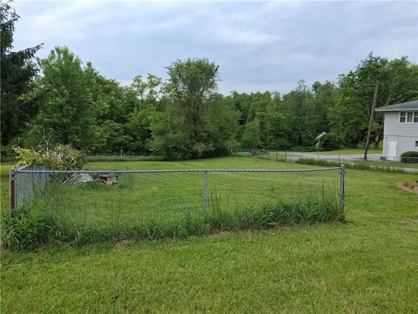 a view of outdoor space with deck and yard