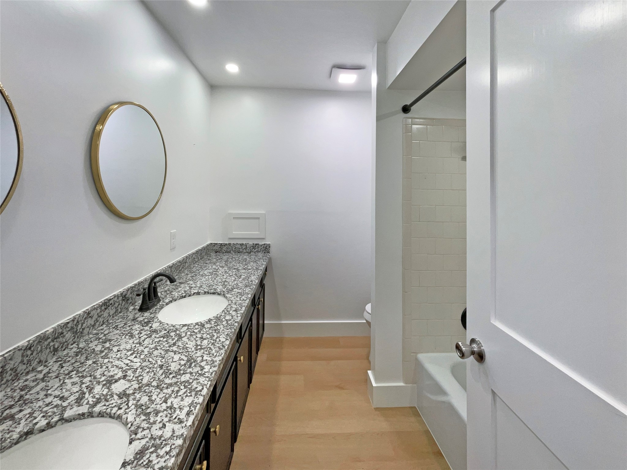 3302 Windsor Drive Pearland, TX 77581 - Photo 19 of 21 a bathroom with a granite countertop sink a mirror and a shower