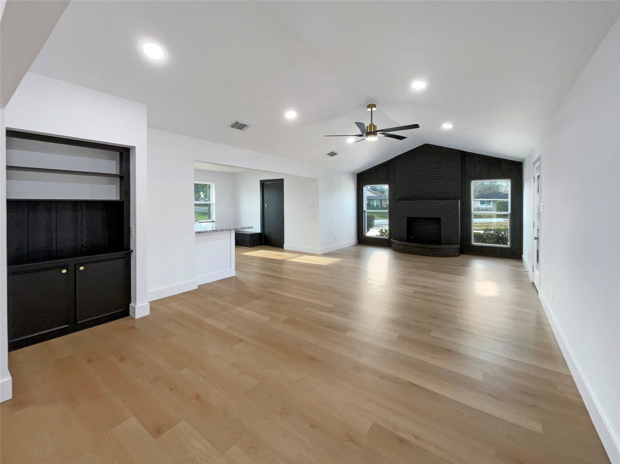 3302 Windsor Drive Pearland, TX 77581 - Photo 3 of 21 a view of an empty room with a fireplace and a living room