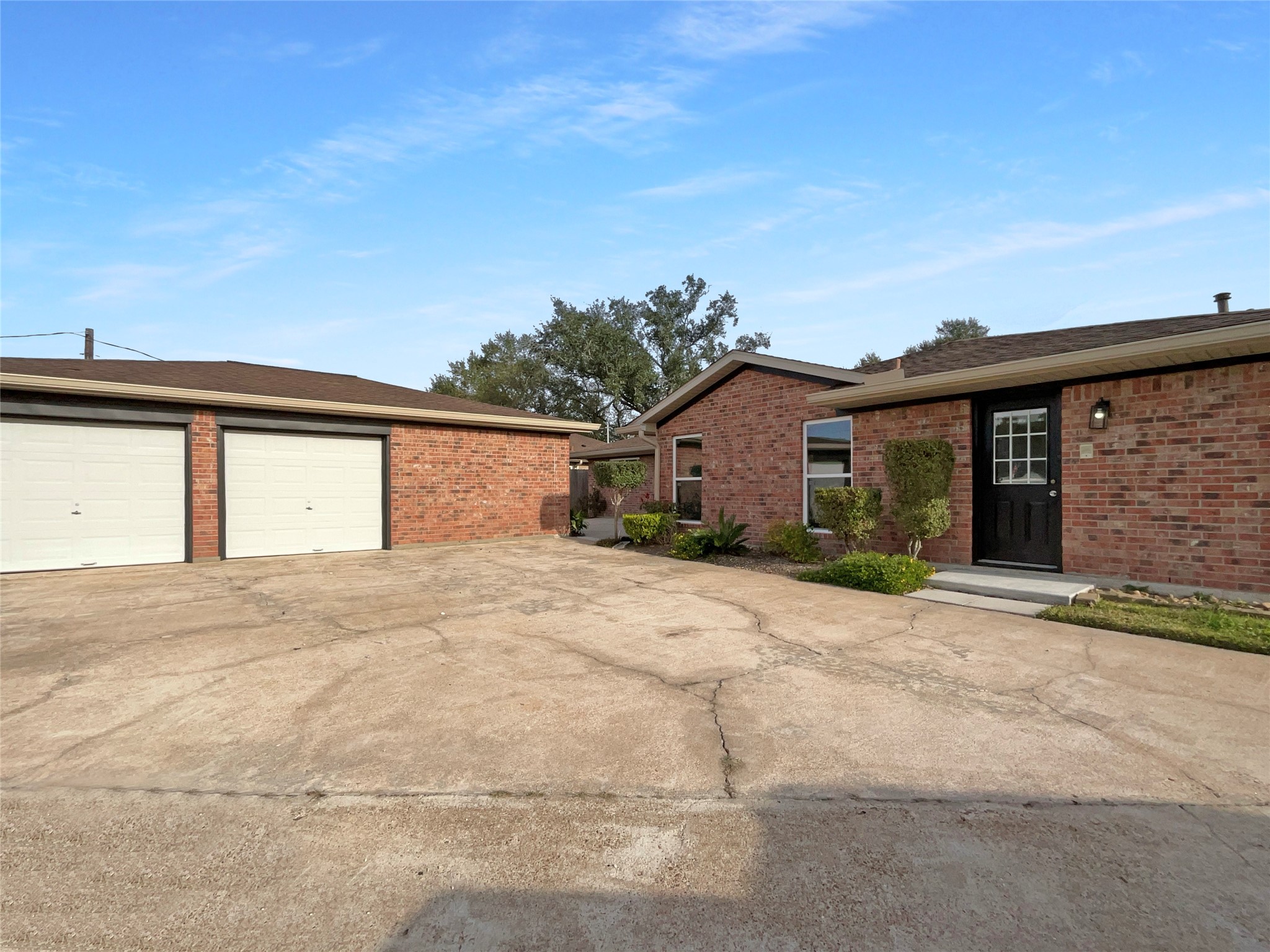 3302 Windsor Drive Pearland, TX 77581 - Photo 5 of 21 a front view of a house with a yard and garage