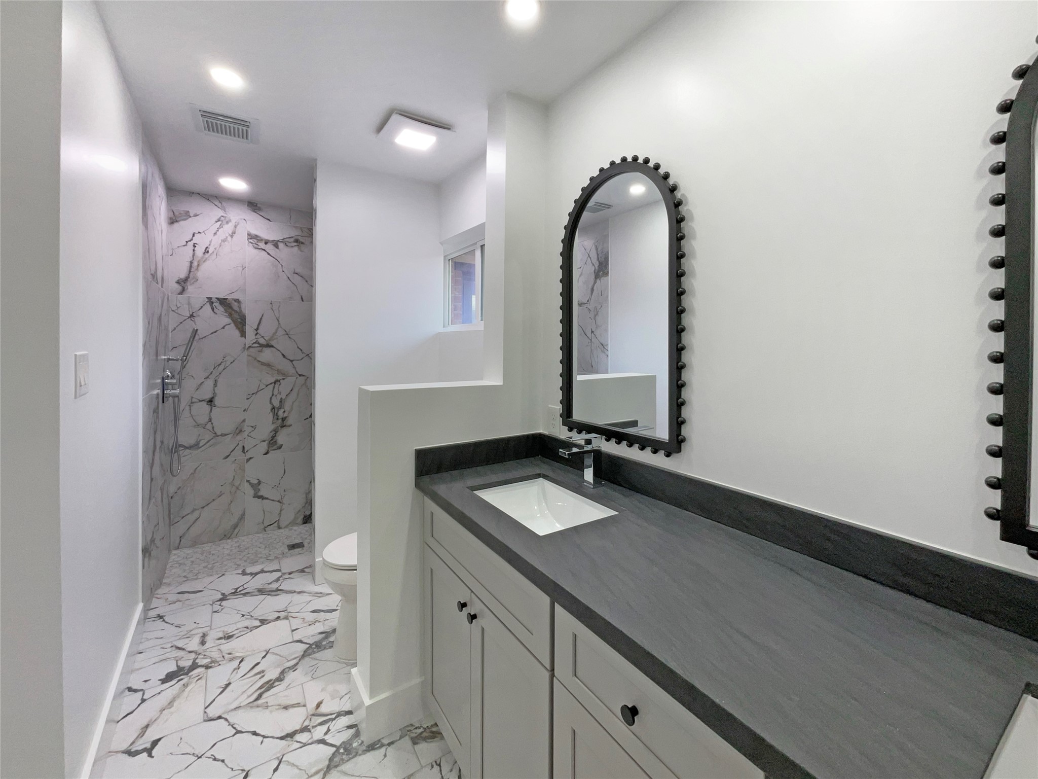 3302 Windsor Drive Pearland, TX 77581 - Photo 6 of 21 a bathroom with a sink a vanity and a mirror