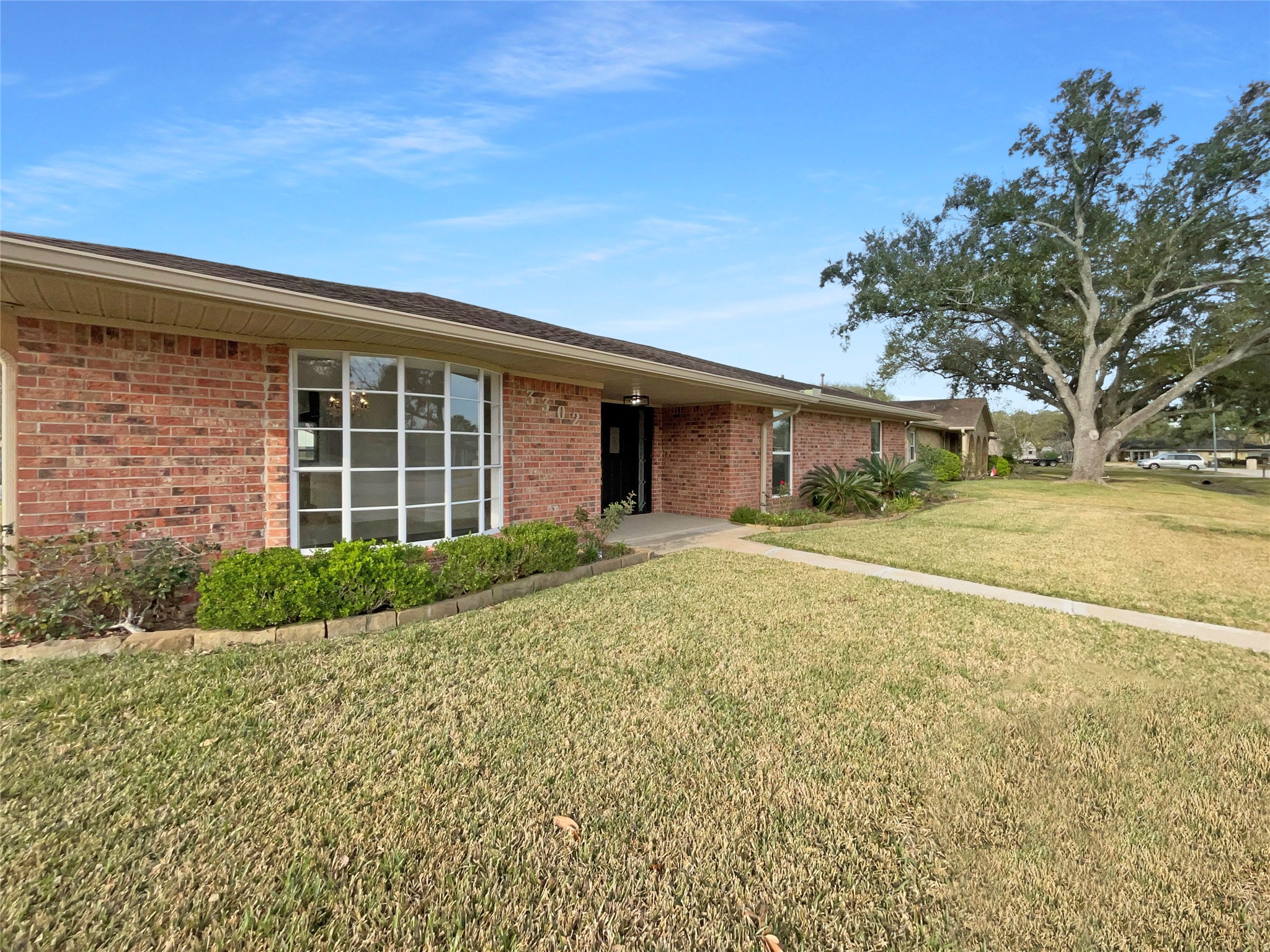 3302 Windsor Drive Pearland, TX 77581 - Photo 7 of 21 a front view of a house with garden