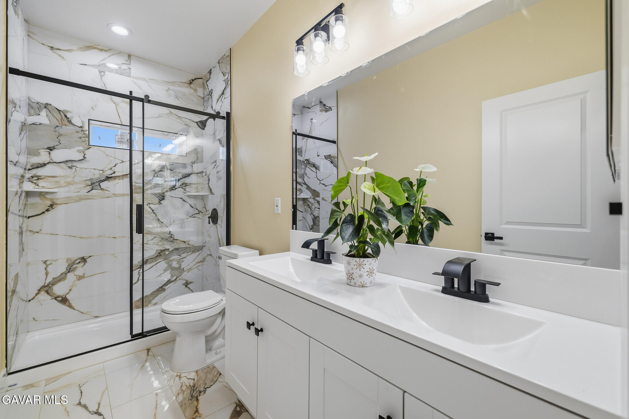 10347 East Ave R 12 Littlerock, CA 93543 - Photo 19 of 32 a bathroom with a sink a toilet and shower