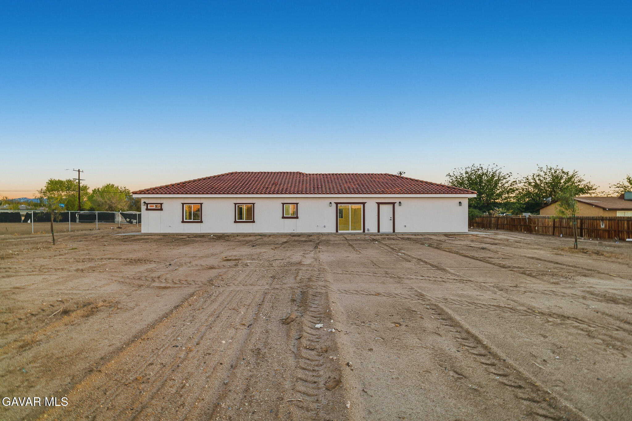 10347 East Ave R 12 Littlerock, CA 93543 - Photo 27 of 32 a front view of a house with a yard