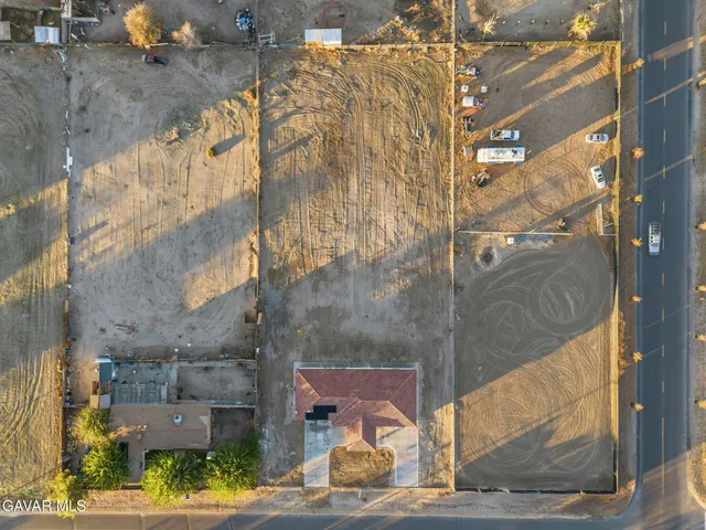 a view of a brick house with a street