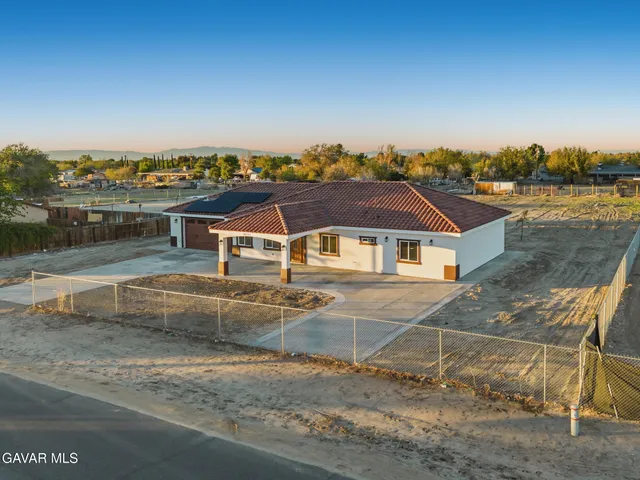 an aerial view of a house with a terrace