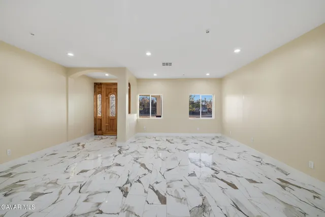 a view of a big room with a large window