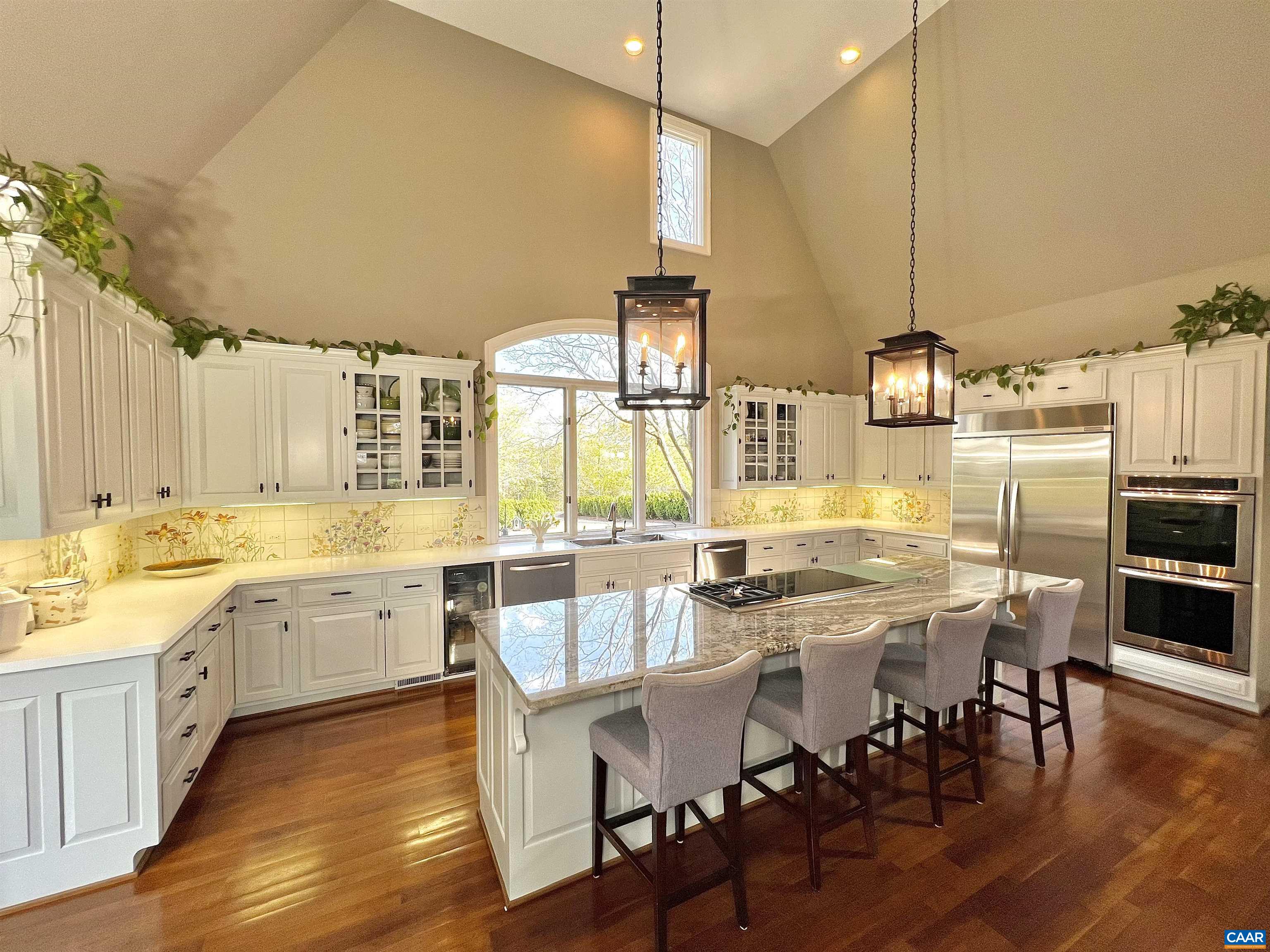 4749 Wesley Chapel Road Free Union, VA 22940 - Photo 17 of 73 a large kitchen with lots of counter space and chairs