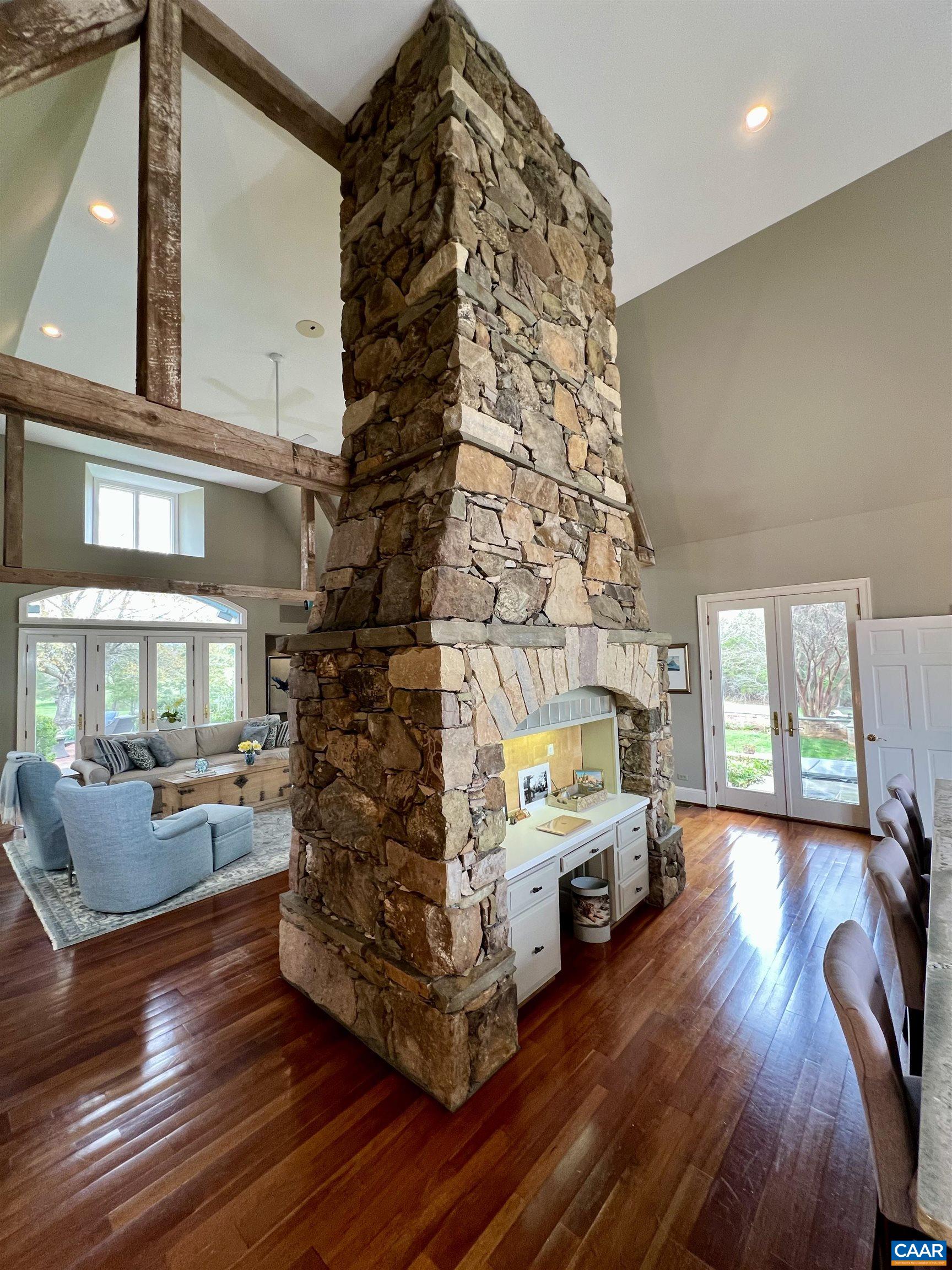 4749 Wesley Chapel Road Free Union, VA 22940 - Photo 22 of 73 a living room with furniture and a fireplace