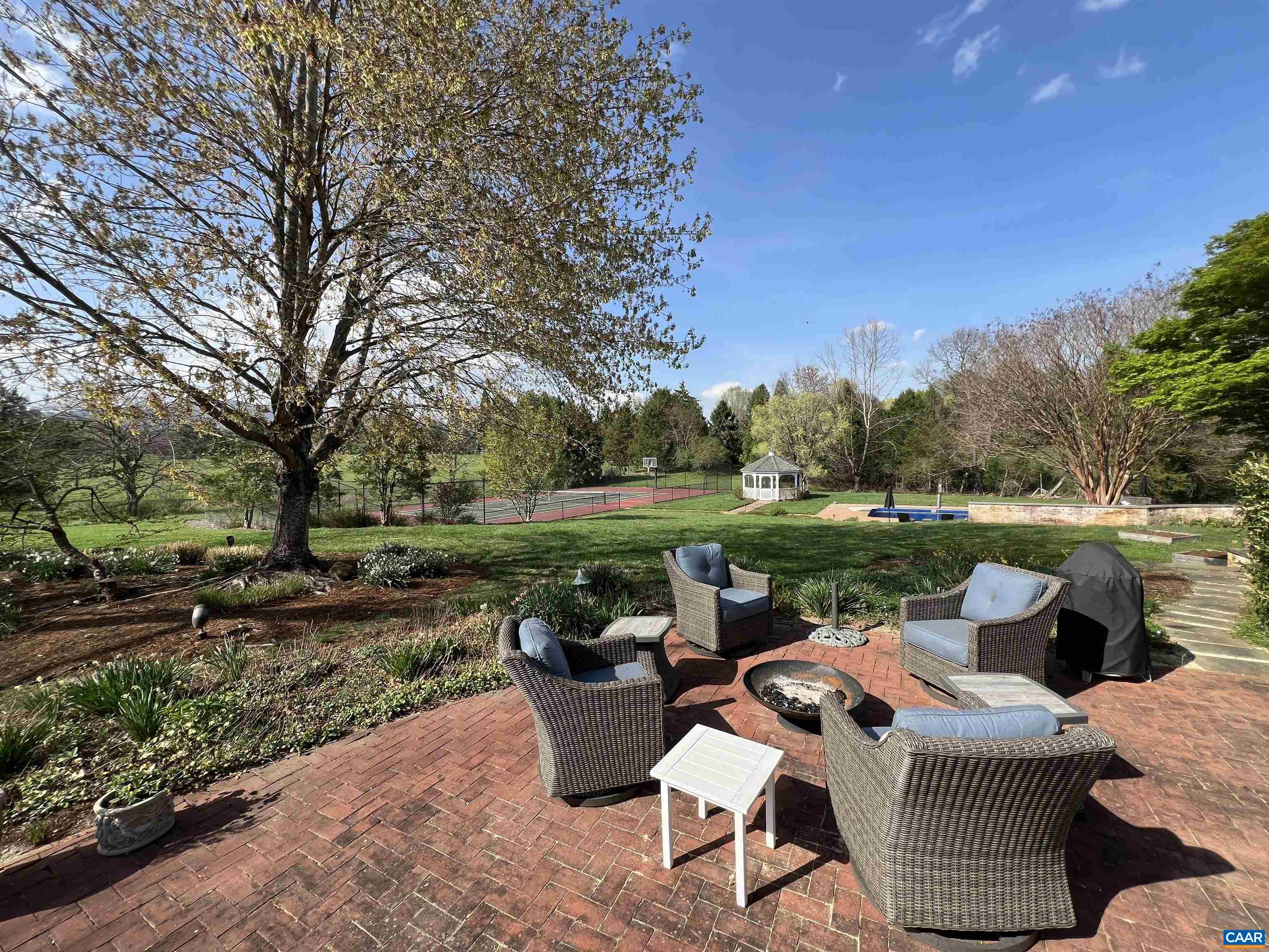 4749 Wesley Chapel Road Free Union, VA 22940 - Photo 29 of 73 a view of a patio with couches chairs and a big yard